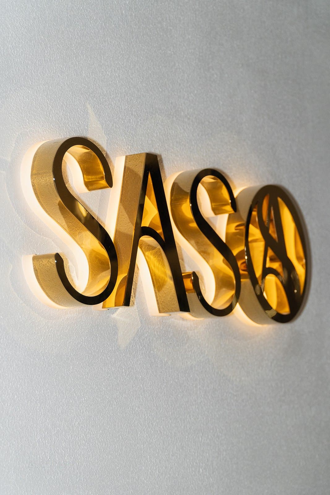 The gold SASO signage at the Westfield Mt Gravatt showroom